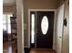 Inviting entryway featuring hardwood floors and a decorative front door with sidelight at 84 Macbeth Ln, Roxboro, NC 27574