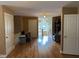 Open hallway area with hardwood floors and staircase, offering access to multiple rooms at 84 Macbeth Ln, Roxboro, NC 27574