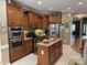 Spacious kitchen featuring stainless steel appliances, an island with granite countertops, and ample cabinet space at 84 Macbeth Ln, Roxboro, NC 27574