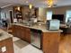 Open kitchen with granite countertops, stainless steel appliances, and a beautiful stone accent wall at 84 Macbeth Ln, Roxboro, NC 27574