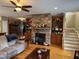 Comfortable living room featuring a stone fireplace, built-in shelving, and an open layout for easy living at 84 Macbeth Ln, Roxboro, NC 27574