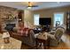 Inviting living room featuring a stone fireplace, built-in bookshelves, and a cozy seating area for relaxation at 84 Macbeth Ln, Roxboro, NC 27574