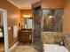 Beautiful main bathroom with tiled shower, soaking tub, and double vanity at 84 Macbeth Ln, Roxboro, NC 27574