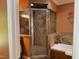 Modern bathroom featuring a glass enclosed shower, bathtub, and a decorative vanity at 84 Macbeth Ln, Roxboro, NC 27574