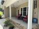 Cozy covered porch with comfortable seating, ceiling fans, and scenic views, perfect for relaxation at 84 Macbeth Ln, Roxboro, NC 27574