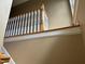 A staircase with a white banister, wooden handrail and hardwood steps at 84 Macbeth Ln, Roxboro, NC 27574