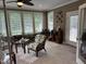 Relaxing sunroom with tiled floors, large windows, and comfortable seating, perfect for enjoying the natural light at 84 Macbeth Ln, Roxboro, NC 27574