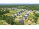 Aerial view of a new construction neighborhood surrounded by lush greenery and expansive lots at 8416 Brady Pointe Rd, Fuquay Varina, NC 27526