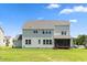 Expansive backyard featuring a well-maintained lawn and a screened porch at 8416 Brady Pointe Rd, Fuquay Varina, NC 27526