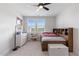 This bedroom features a ceiling fan, two windows and neutral walls and flooring at 8416 Brady Pointe Rd, Fuquay Varina, NC 27526