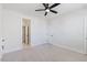 Unfurnished bedroom features neutral carpet, ceiling fan, recessed lights and multiple closets at 8416 Brady Pointe Rd, Fuquay Varina, NC 27526