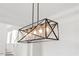 Modern chandelier in a dining room with a geometric design and clear glass shades at 8416 Brady Pointe Rd, Fuquay Varina, NC 27526