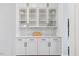 Elegant built-in cabinets with glass doors, marble backsplash and countertops at 8416 Brady Pointe Rd, Fuquay Varina, NC 27526