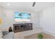 Comfortable living room with a large TV and modern entertainment center at 8416 Brady Pointe Rd, Fuquay Varina, NC 27526
