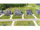 Beautiful street view of craftsman-style homes with well-manicured lawns and mature trees at 8416 Brady Pointe Rd, Fuquay Varina, NC 27526