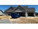 Charming single Gathering home, light gray, showing construction progress at 91 Retreat Run, Smithfield, NC 27577