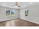 Bedroom filled with natural light, featuring hardwood flooring and neutral paint at 1012 Rainey St, Burlington, NC 27217