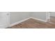 Bedroom showcasing a gray wall, white trim, and updated wood flooring at 1012 Rainey St, Burlington, NC 27217