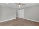 Large bedroom with hardwood flooring, neutral paint, and two closets at 1012 Rainey St, Burlington, NC 27217