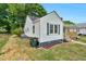View of the exterior of the house highlighting the side yard and access at 1012 Rainey St, Burlington, NC 27217