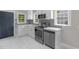 Beautifully renovated kitchen with stainless steel appliances, white cabinets, and modern finishes at 1012 Rainey St, Burlington, NC 27217