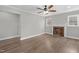 Spacious living room with hardwood floors, a decorative fireplace, and ample natural light at 1012 Rainey St, Burlington, NC 27217