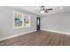 Image shows well-lit living room featuring hardwood floors and large window at 1012 Rainey St, Burlington, NC 27217