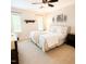 Serene bedroom with plush carpeting, neutral colors, a ceiling fan, and natural lighting at 102 Kipling Dr, Oxford, NC 27565