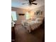 Bedroom featuring two large windows, carpeted floors, neutral walls, and a comfortable queen bed at 102 Kipling Dr, Oxford, NC 27565