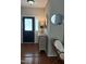 Welcoming foyer featuring hardwood floors, decorative mirror, and elegant furnishings at 102 Kipling Dr, Oxford, NC 27565