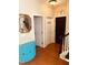 Hallway with wood floors, a blue cabinet, and a deer head decoration at 102 Kipling Dr, Oxford, NC 27565