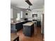 Spacious kitchen featuring granite countertops, stainless steel appliances, and central island at 102 Kipling Dr, Oxford, NC 27565