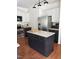 Spacious kitchen featuring granite countertops, stainless steel appliances, and central island at 102 Kipling Dr, Oxford, NC 27565