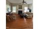 Cozy living room with hardwood floors, a fireplace, and abundant natural light at 102 Kipling Dr, Oxford, NC 27565