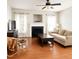 Bright living room features a fireplace, hardwood floors, and abundant natural light at 102 Kipling Dr, Oxford, NC 27565