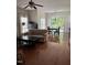 Open-concept living room with hardwood floors, access to a deck, and plenty of natural light at 102 Kipling Dr, Oxford, NC 27565