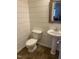 Charming powder room with shiplap walls, pedestal sink, and tiled floors at 102 Kipling Dr, Oxford, NC 27565