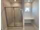 Tiled shower with glass enclosure and built-in bench seating in the bathroom at 1033 Bostonian Dr, Knightdale, NC 27545