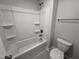 Bathroom with white shower and toilet at 1033 Bostonian Dr, Knightdale, NC 27545