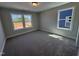 An empty bedroom with gray walls and carpet at 1033 Bostonian Dr, Knightdale, NC 27545