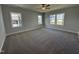 Bright bedroom with plush carpeting and multiple windows offering ample natural light at 1033 Bostonian Dr, Knightdale, NC 27545