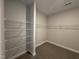 Walk-in closet with carpeted floor and extensive wire shelving providing ample storage space at 1033 Bostonian Dr, Knightdale, NC 27545