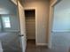 Hall closet with wire shelving and views of the bedroom on either side at 1033 Bostonian Dr, Knightdale, NC 27545