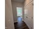 Hallway entrance with hardwood floors leading to a living area and a closet at 1033 Bostonian Dr, Knightdale, NC 27545