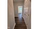 Hallway entrance with hardwood floors leading to a living area and a closet at 1033 Bostonian Dr, Knightdale, NC 27545