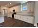 Bright kitchen featuring white cabinets, granite countertops, and stainless steel appliances at 1033 Bostonian Dr, Knightdale, NC 27545