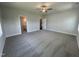 Spacious main bedroom with plush carpeting, fan, multiple windows, and ensuite bathroom at 1033 Bostonian Dr, Knightdale, NC 27545