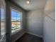 Walk-in closet with a street view from the window and wire shelving at 1033 Bostonian Dr, Knightdale, NC 27545
