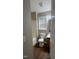 Modern bathroom features a tub-shower, sleek vanity, stylish mirror, and laminate flooring at 106 Grange Dr, Wendell, NC 27591