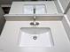 Bathroom vanity with white countertop, modern faucet, and undermount sink at 106 Grange Dr, Wendell, NC 27591